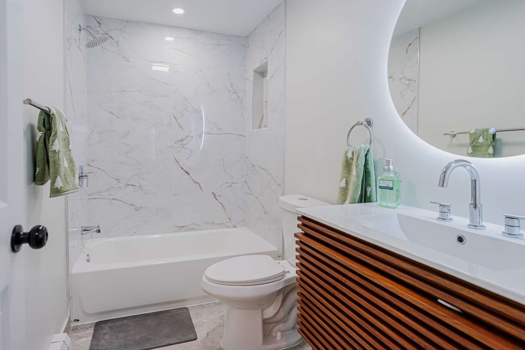 27 Silver Road, Unit 27 Everett, MA 02149 - Photo 28 of 42 a bathroom with a sink a toilet and shower