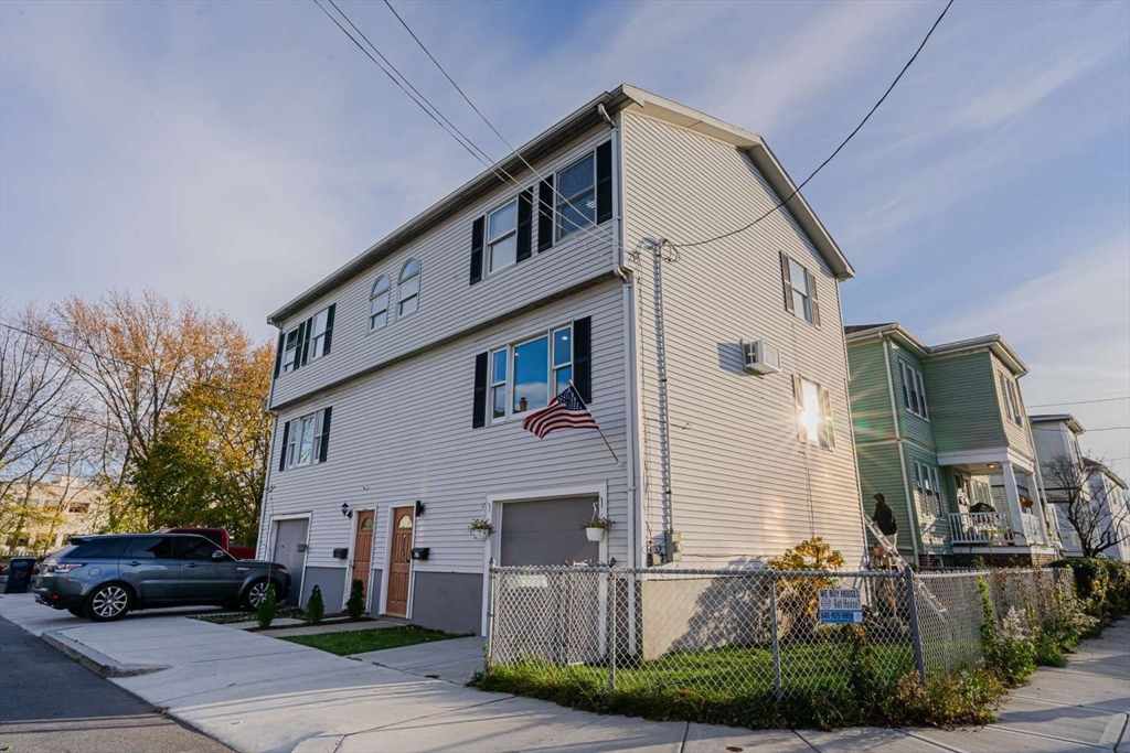 27 Silver Road, Unit 27 Everett, MA 02149 - Photo 37 of 42 a front view of a house with garden