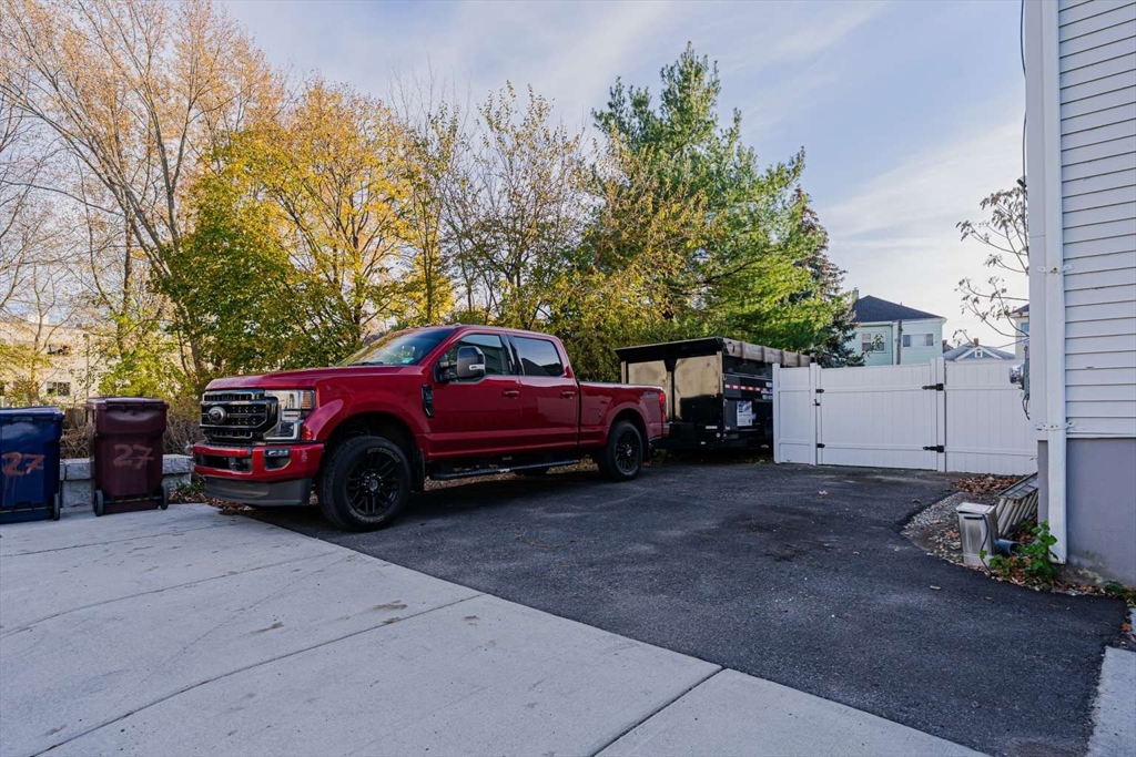 27 Silver Road, Unit 27 Everett, MA 02149 - Photo 39 of 42 a view of a car is parked in front of a house