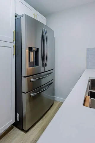 a hallway with washer and dryer