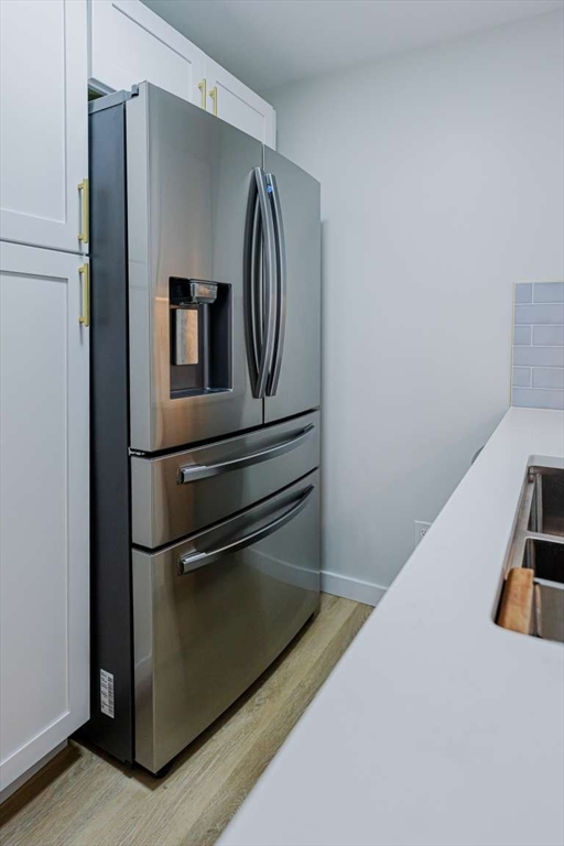 27 Silver Road, Unit 27 Everett, MA 02149 - Photo 4 of 42 a hallway with washer and dryer