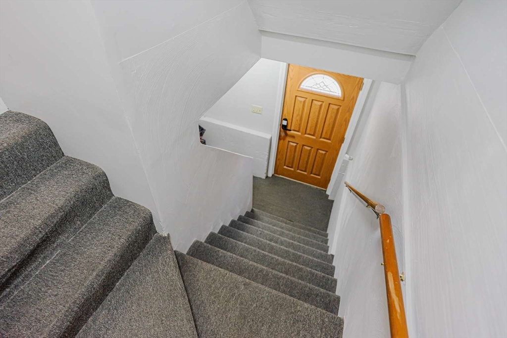 27 Silver Road, Unit 27 Everett, MA 02149 - Photo 41 of 42 a view of staircase with wooden floor and window