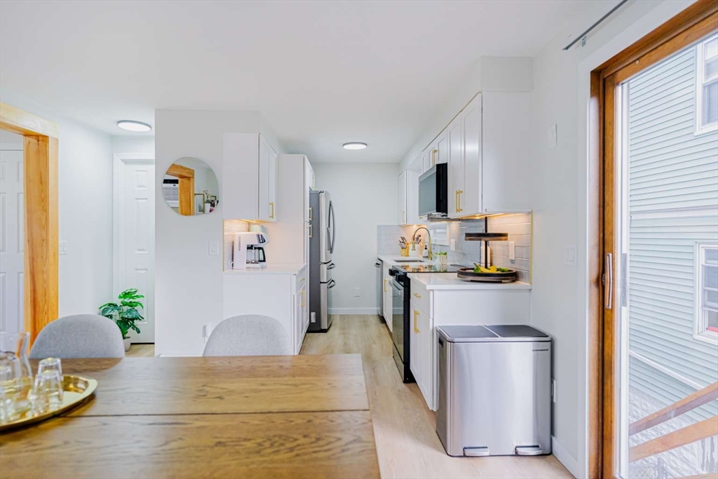 27 Silver Road, Unit 27 Everett, MA 02149 - Photo 8 of 42 a living room with furniture and a window