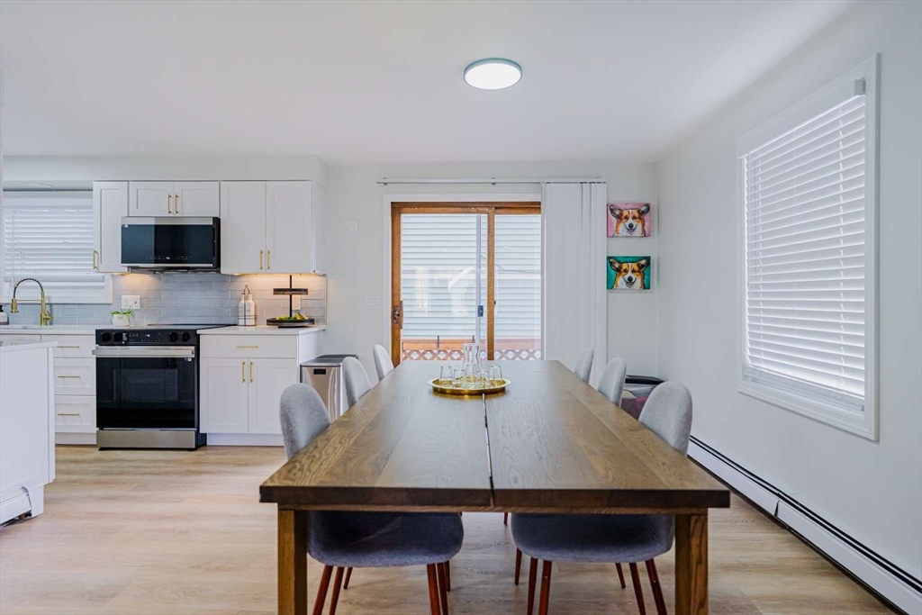 27 Silver Road, Unit 27 Everett, MA 02149 - Photo 10 of 42 a view of a kitchen with a table and chairs