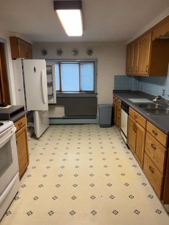 23 Edgewood Road Billerica, MA 01821 - Photo 28 of 40 a kitchen with a stove a sink and a refrigerator