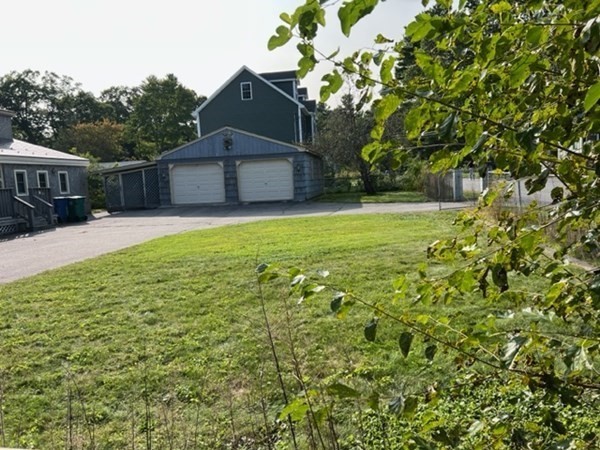23 Edgewood Road Billerica, MA 01821 - Photo 3 of 40 a backyard of a house with lots of green space