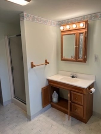 23 Edgewood Road Billerica, MA 01821 - Photo 40 of 40 a bathroom with a sink and a mirror