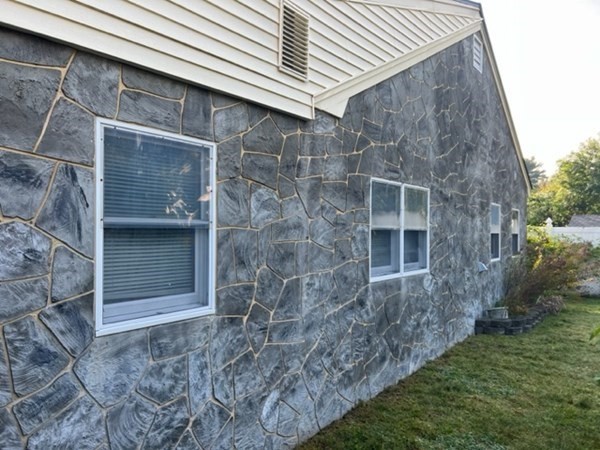 23 Edgewood Road Billerica, MA 01821 - Photo 8 of 40 a brick house with a yard