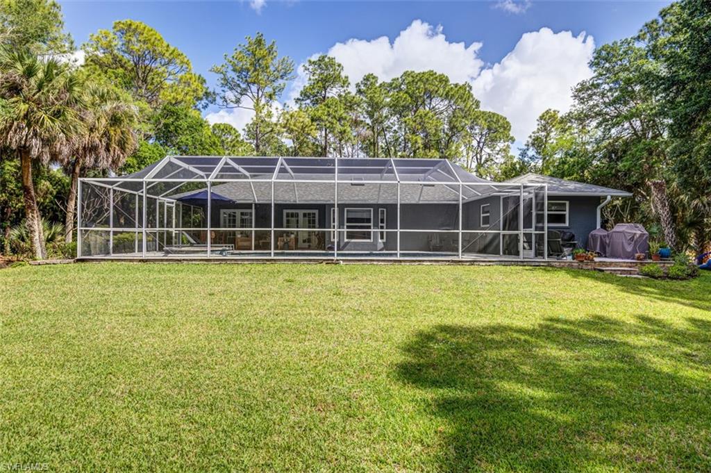 4710 15th Avenue Southwest Naples, FL 34116 - Photo 12 of 49 a view of a house with a backyard