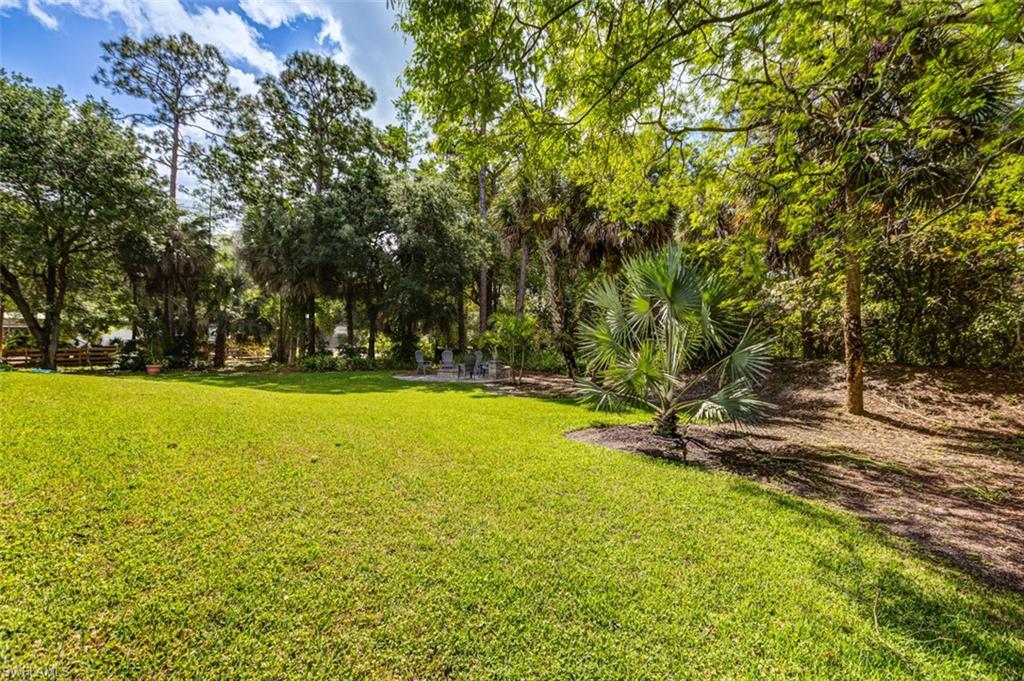 4710 15th Avenue Southwest Naples, FL 34116 - Photo 13 of 49 a view of yard and swimming pool