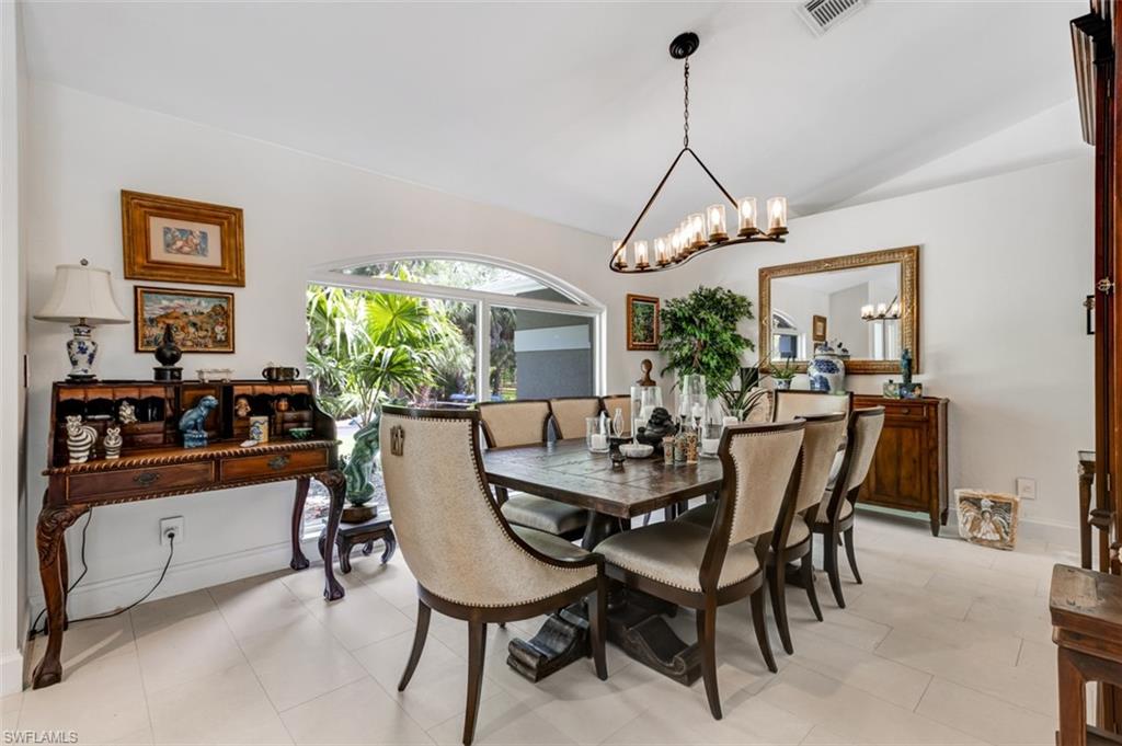 4710 15th Avenue Southwest Naples, FL 34116 - Photo 15 of 49 a dining room with furniture and window