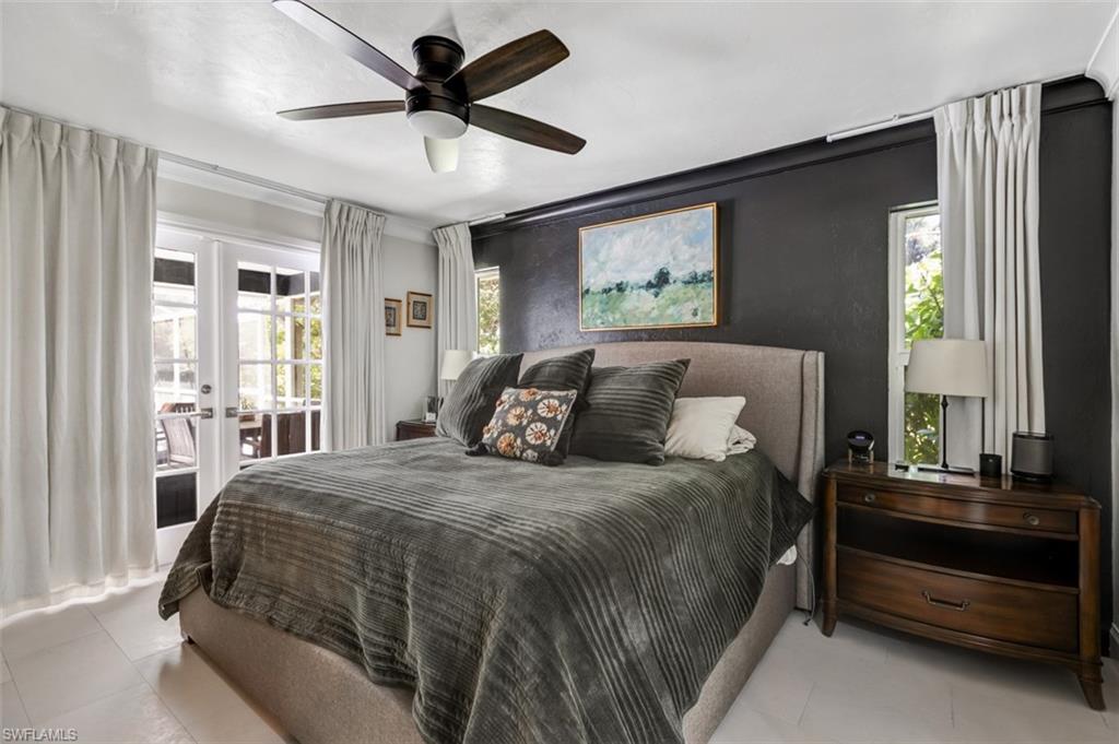 4710 15th Avenue Southwest Naples, FL 34116 - Photo 19 of 49 a bedroom with a bed and a window