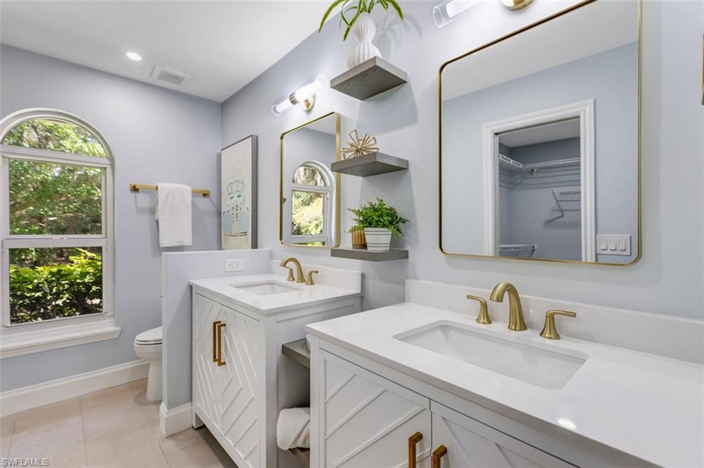 4710 15th Avenue Southwest Naples, FL 34116 - Photo 21 of 49 a bathroom with a sink and a mirror