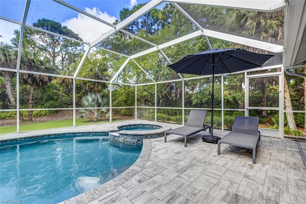 4710 15th Avenue Southwest Naples, FL 34116 - Photo 4 of 49 a view of house with swimming pool outdoor seating and yard in back