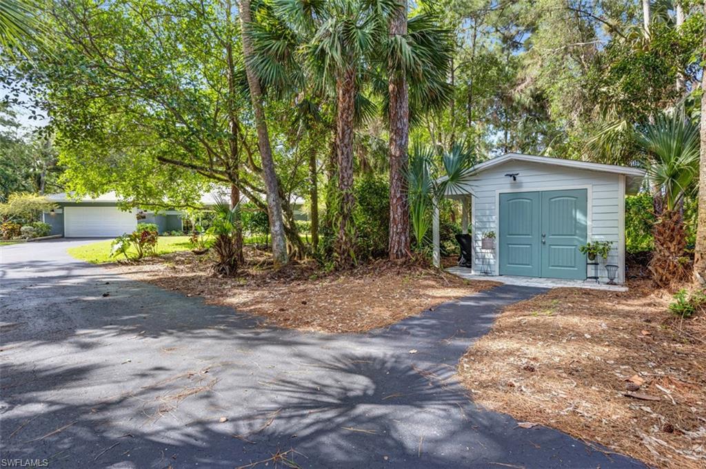 4710 15th Avenue Southwest Naples, FL 34116 - Photo 44 of 49 a view of a yard in front of a house