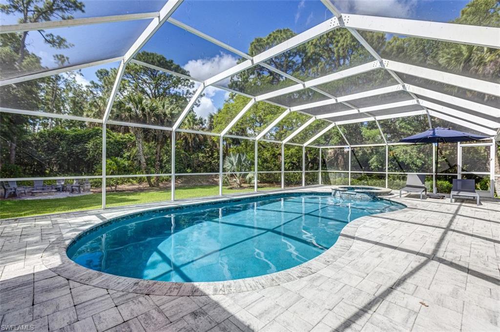 4710 15th Avenue Southwest Naples, FL 34116 - Photo 7 of 49 a view of a backyard with a swimming pool