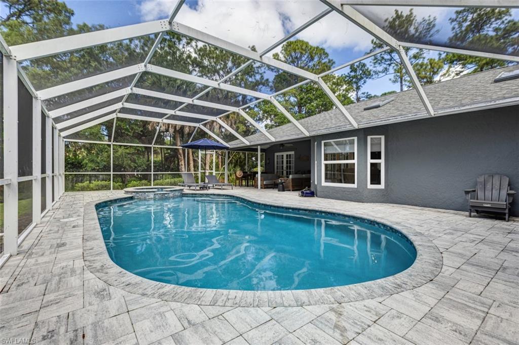 4710 15th Avenue Southwest Naples, FL 34116 - Photo 8 of 49 a view of a swimming pool with a patio