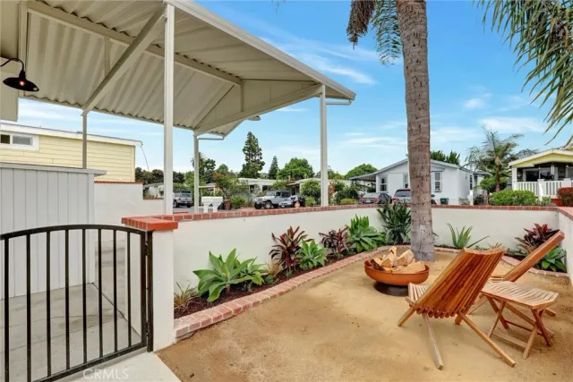 a view of a patio with a table chairs and a table