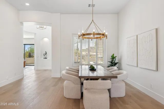 a view of a dining room with furniture and window
