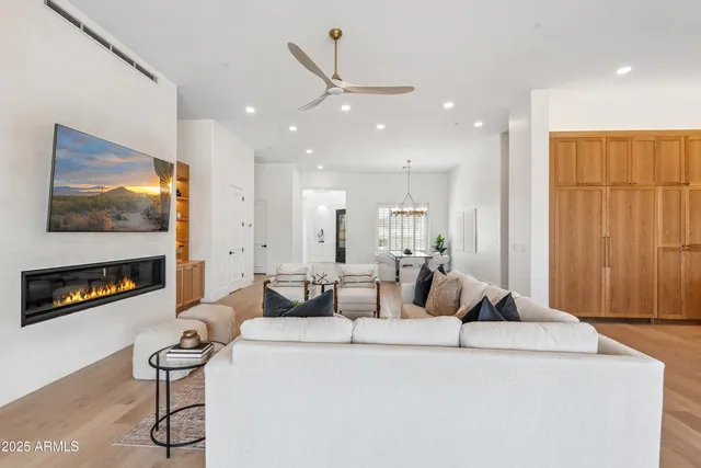 a bedroom with a bed a couch and a window