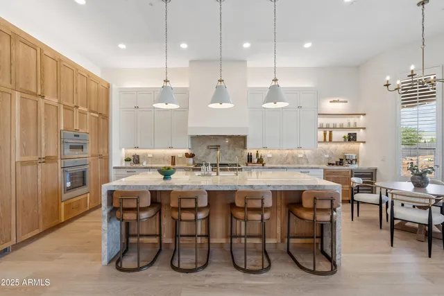 a bathroom with a double vanity sink and mirror