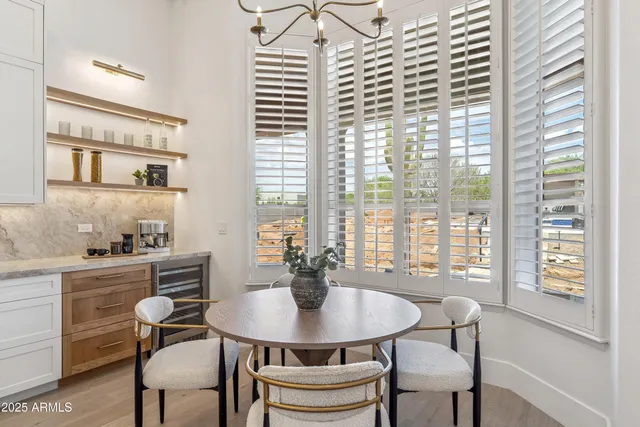 a en suite bathroom with a double vanity sink and a mirror