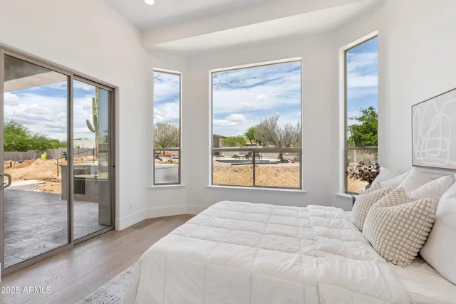 a view of a house with swimming pool and sitting area