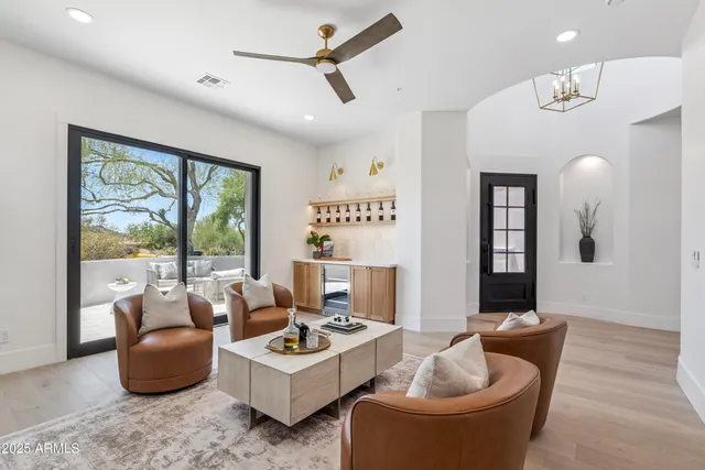 a living room with furniture and a large window