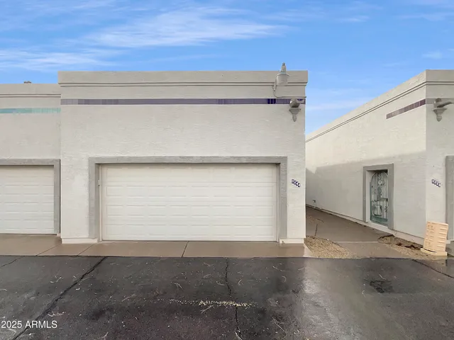 a kitchen with a sink a stove top oven and wooden floor