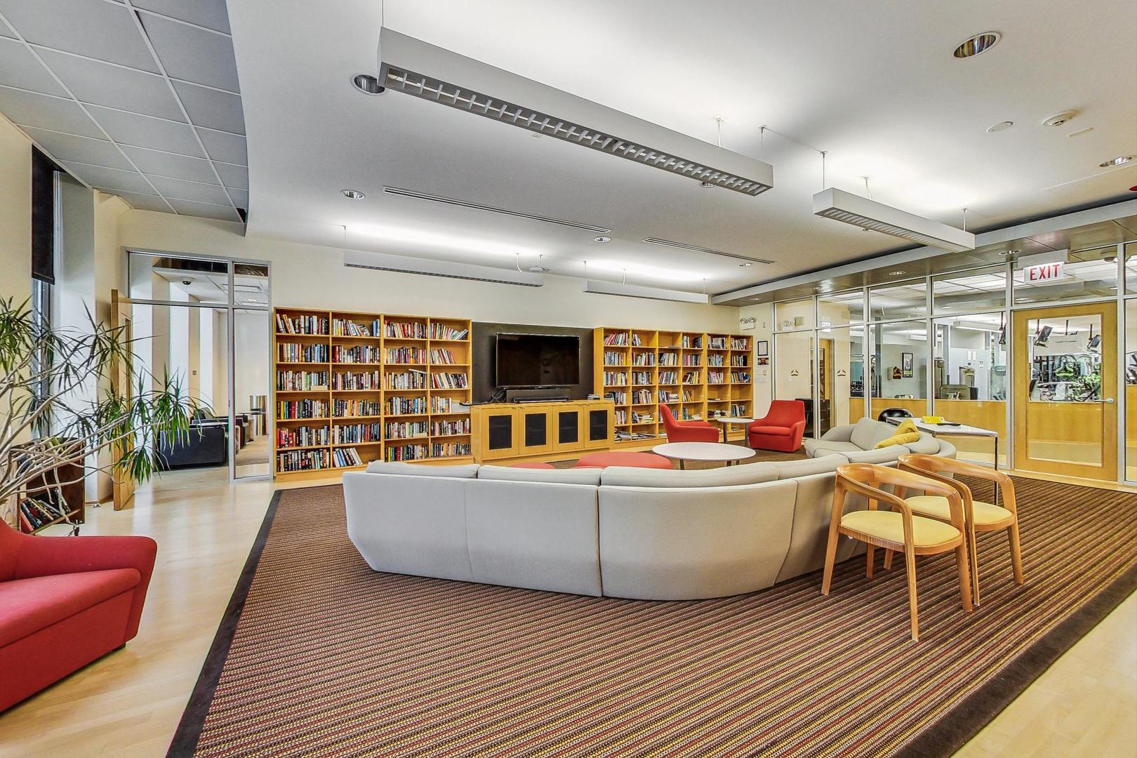 505 North Lake Shore Drive, Unit 1804 Chicago, IL 60611 - Photo 19 of 24 a living room with furniture and a large window