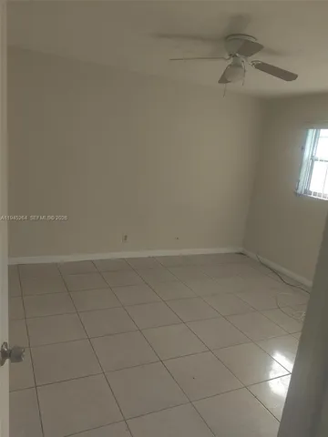 a kitchen with a sink cabinets and appliances