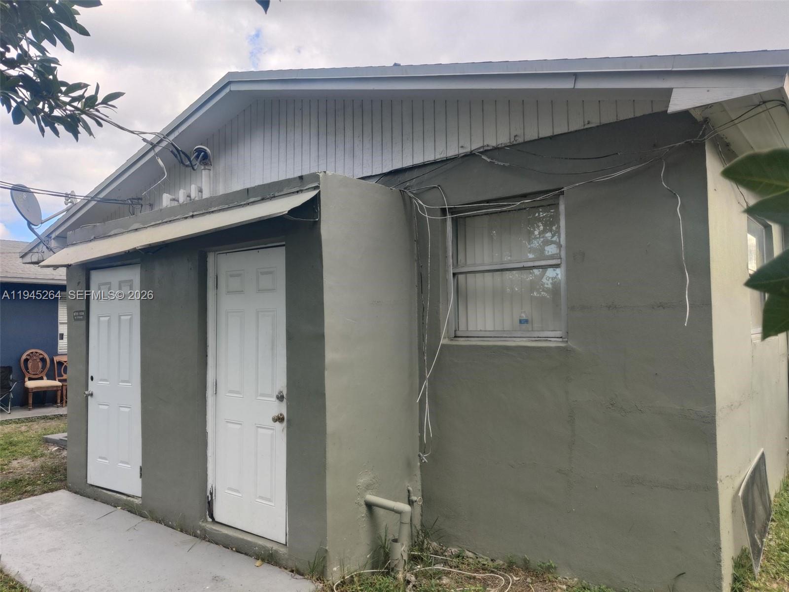 844 Southwest 10th Street Hallandale Beach, FL 33009 - Photo 5 of 18 a front view of a house