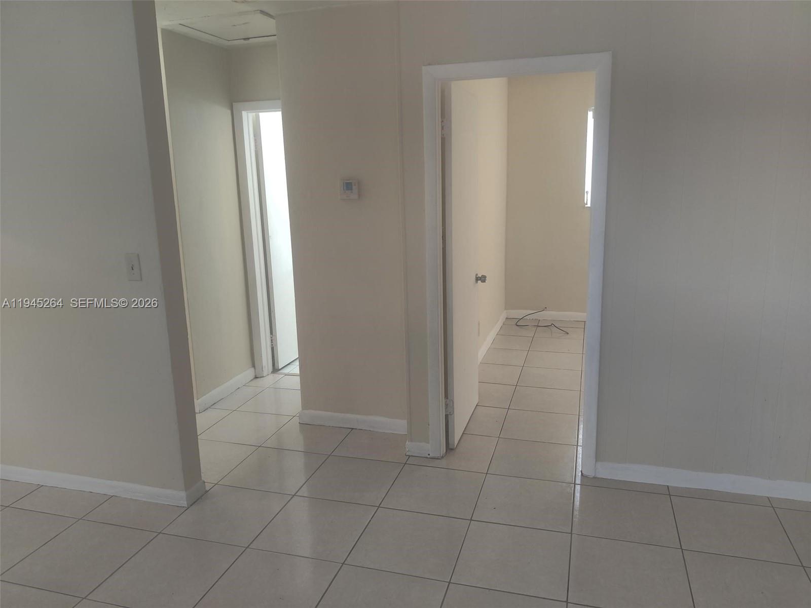 844 Southwest 10th Street Hallandale Beach, FL 33009 - Photo 9 of 18 an empty room with mirror
