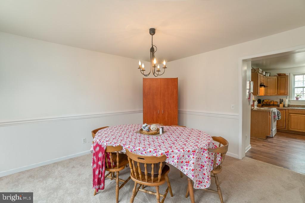 Separate formal dining room with chair rail