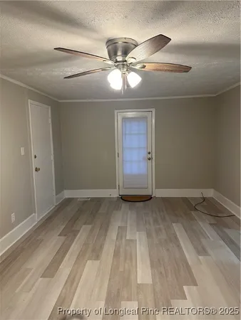 a view of an empty room and window