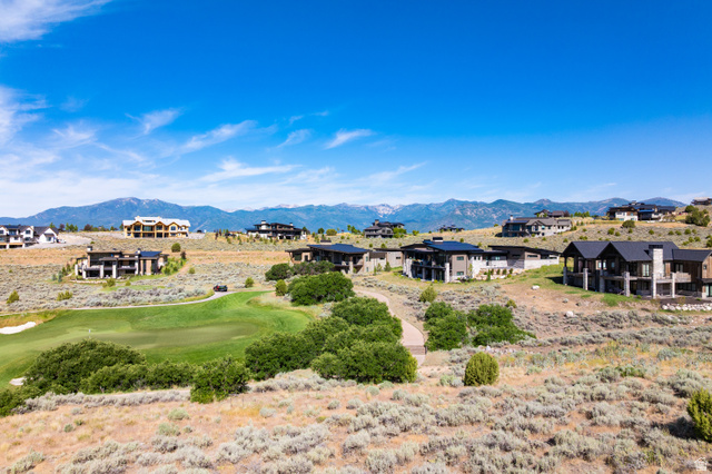 2712 East Boulder Top Loop, Unit 583 Heber City, UT 84032 - Photo 5 of 17 Expansive properties featuring varied contemporary architectural styles, integrated into a natural, elevated landscape