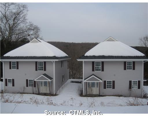 169 Leesville Road, Unit 12 East Haddam, CT 06469 - Photo 1 of 1 a front view of a house with a yard