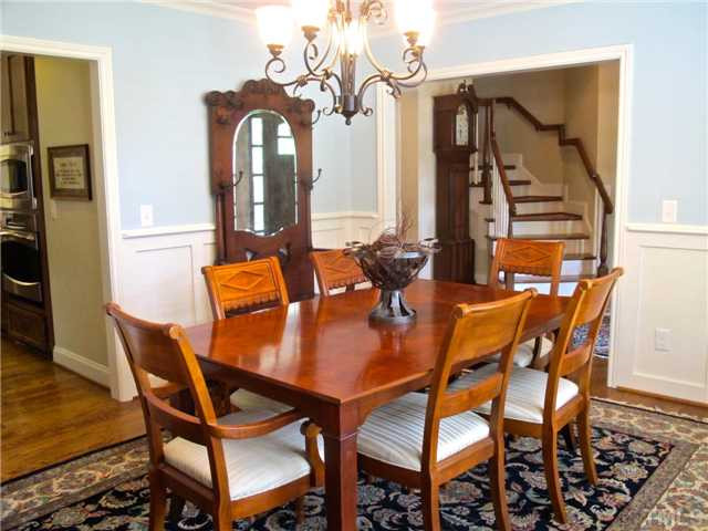 907 Shelley Road Raleigh, NC 27609 - Photo 5 of 23 a view of a dining room with furniture and wooden floor