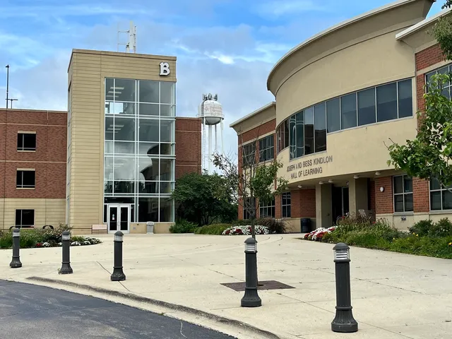 a view of a building with a yard