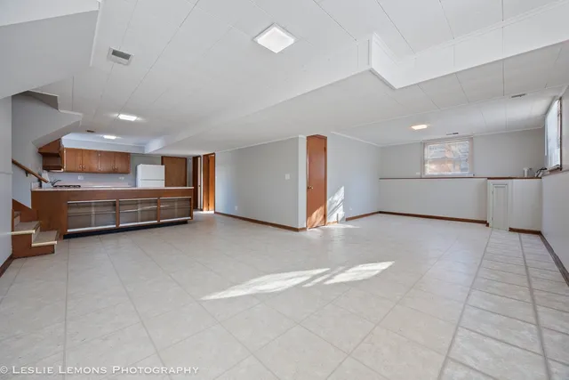 a view of kitchen and refrigerator in a room