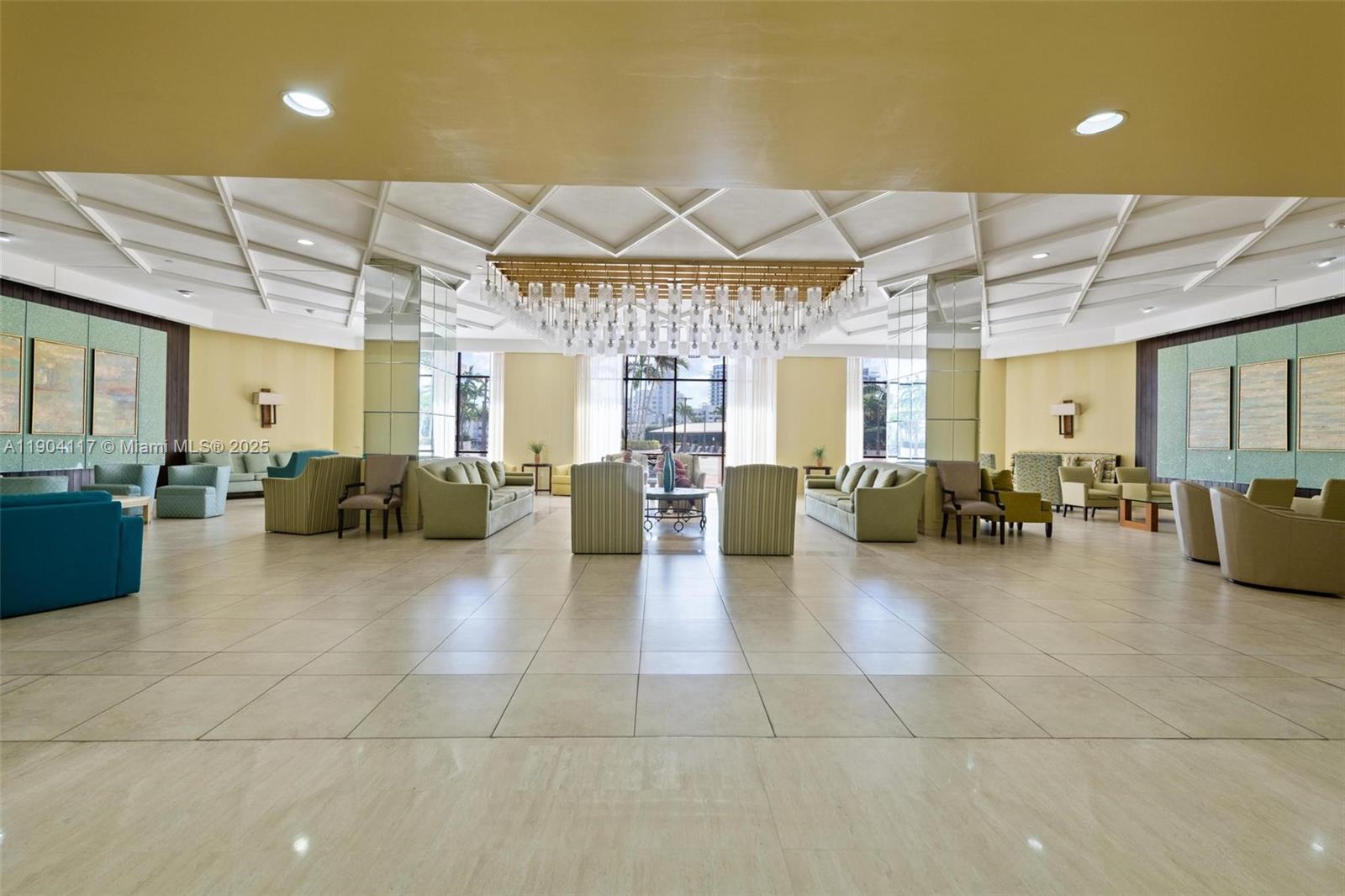 4101 Pine Tree Drive, Unit 707 Miami Beach, FL 33140 - Photo 22 of 41 a lobby with furniture and a chandelier