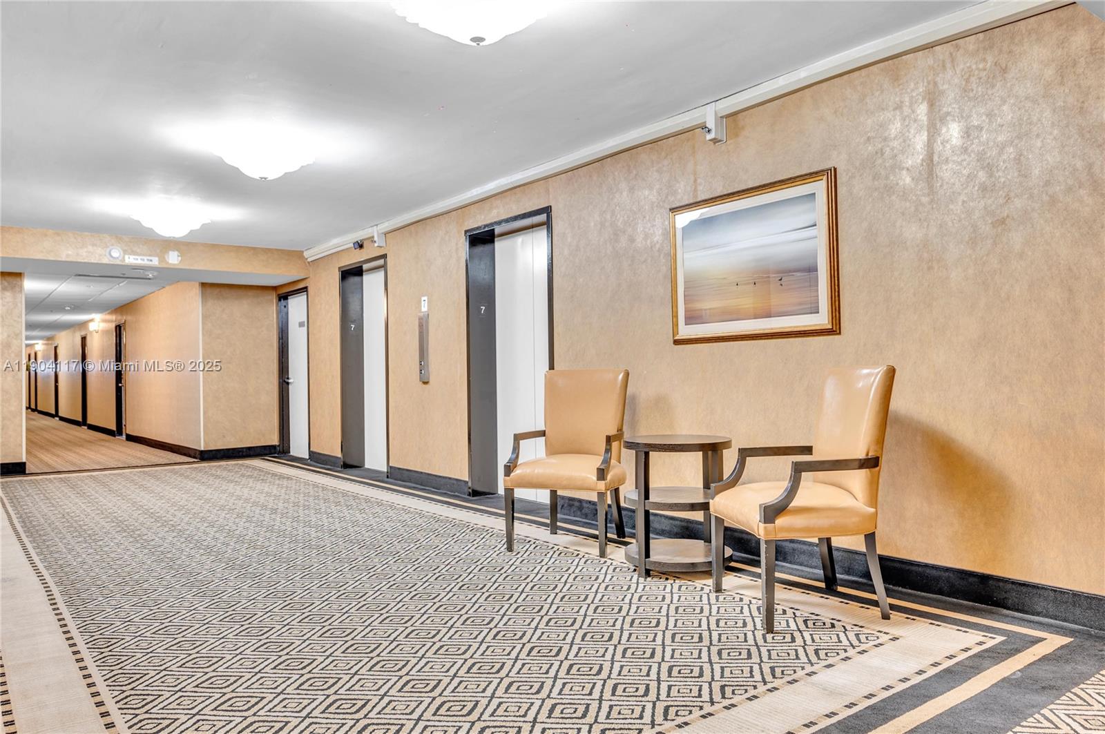 4101 Pine Tree Drive, Unit 707 Miami Beach, FL 33140 - Photo 40 of 41 a view of a livingroom with furniture and staircase