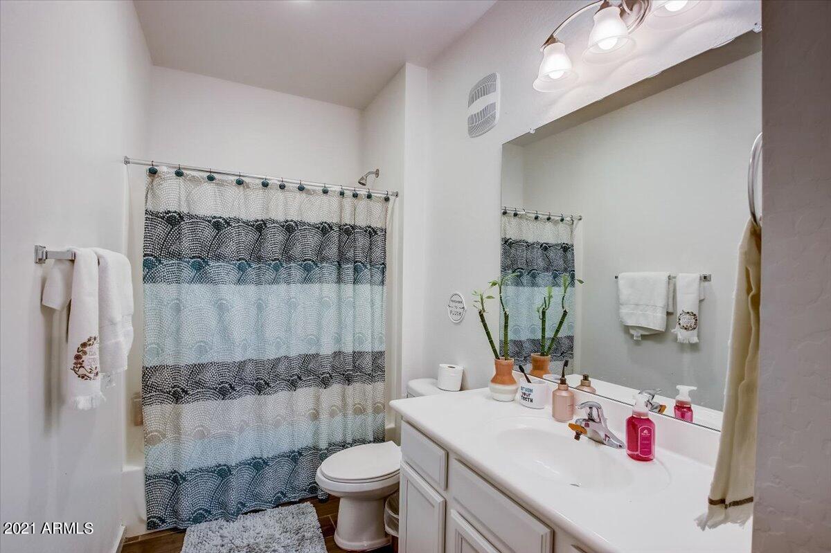 3900 East Baseline Road, Unit 127 Phoenix, AZ 85042 - Photo 29 of 60 a bathroom with a sink vanity granite toilet and shower