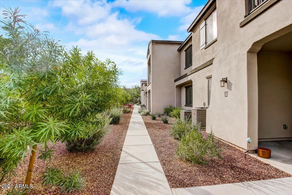 3900 East Baseline Road, Unit 127 Phoenix, AZ 85042 - Photo 3 of 60 a view of a pathway with house on both side