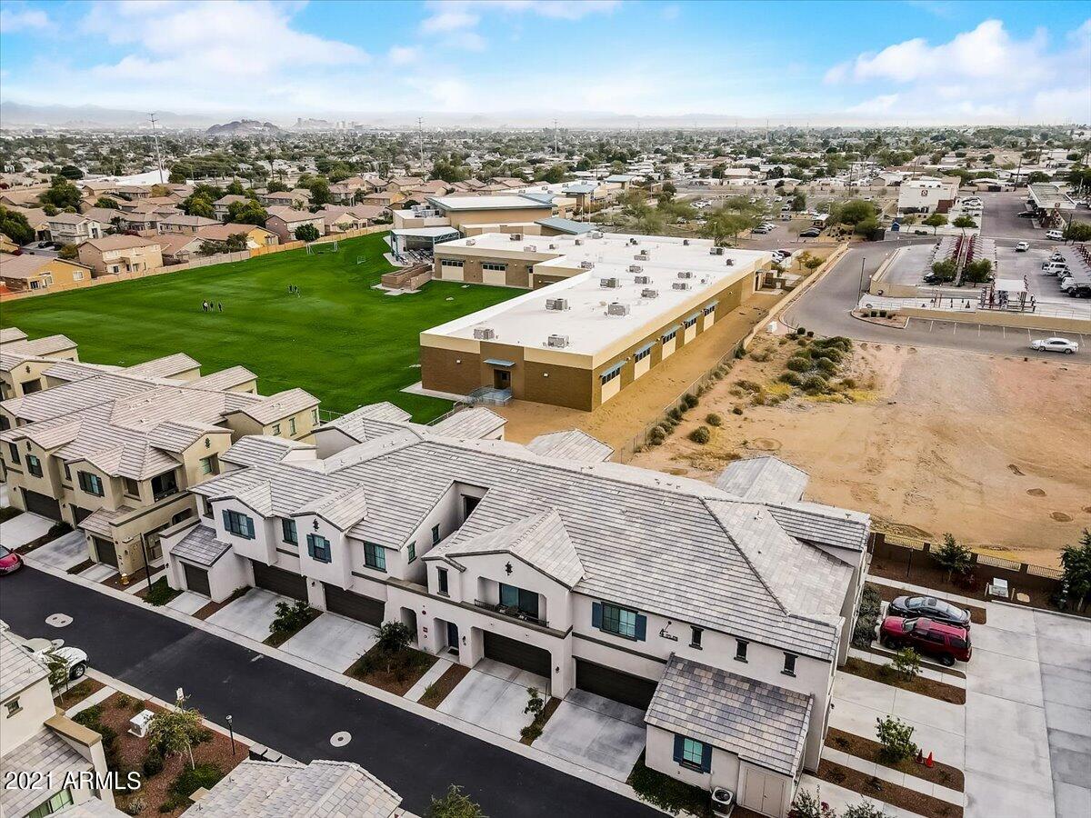3900 East Baseline Road, Unit 127 Phoenix, AZ 85042 - Photo 59 of 60 an aerial view of a residential building with parking space