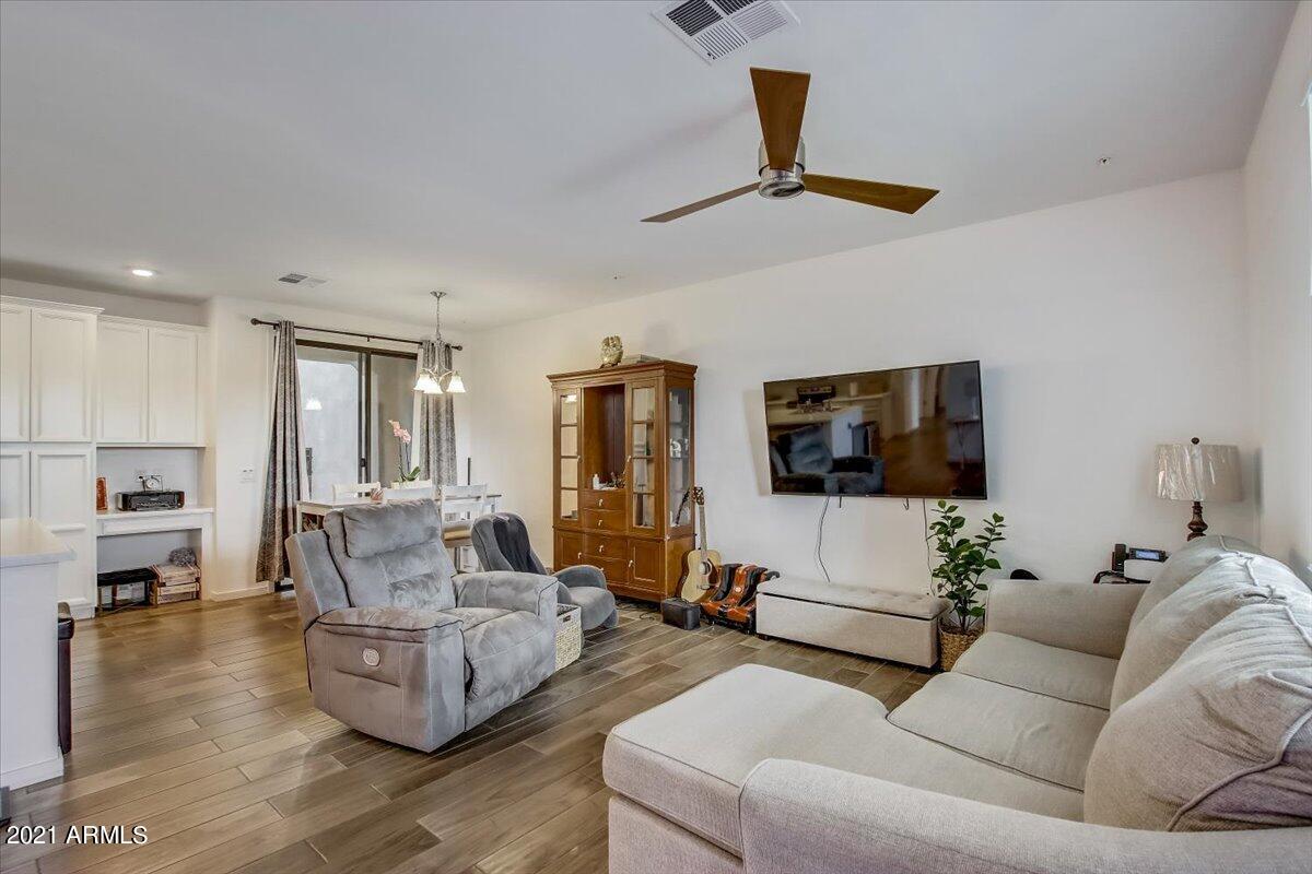 3900 East Baseline Road, Unit 127 Phoenix, AZ 85042 - Photo 8 of 60 a living room with furniture and a flat screen tv