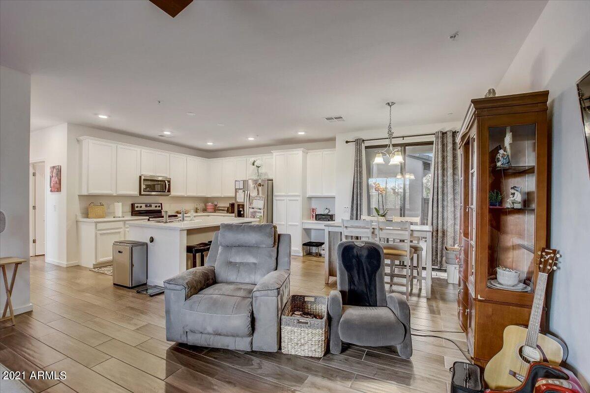 3900 East Baseline Road, Unit 127 Phoenix, AZ 85042 - Photo 10 of 60 a living room with furniture and a fireplace