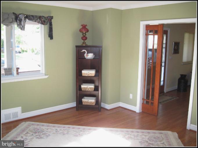 6498 Little Falls Road Arlington, VA 22213 - Photo 16 of 30 Library with pocket doors for space savings