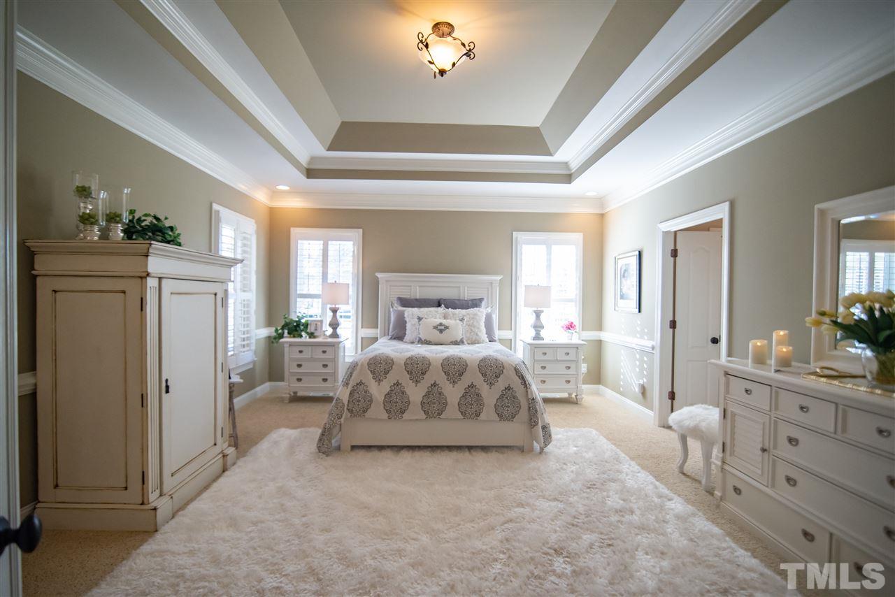 2203 Hopeton Avenue Raleigh, NC 27614 - Photo 15 of 25 Retreat to your master bedroom suite! Gorgeously crafted with tray ceiling and soothing paint tones, this is a perfectly pulled together relaxation space.