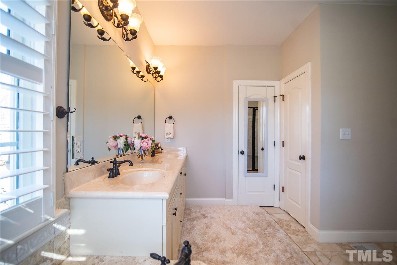 2203 Hopeton Avenue Raleigh, NC 27614 - Photo 17 of 25 Master Bathroom also features private water closet and additional storage in linen closet.